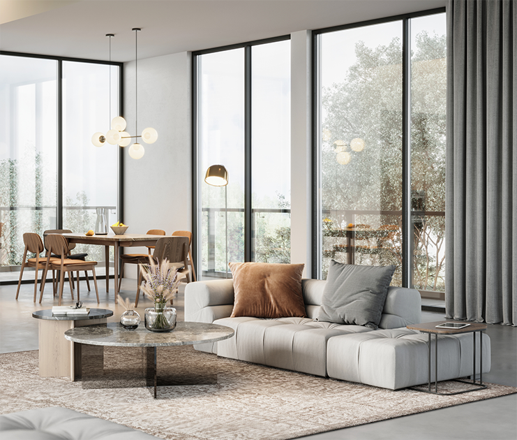 Modern luxury interior living space with large windows, comfortable sectional sofa, and elegant dining area showcasing RLG Development's quality craftsmanship